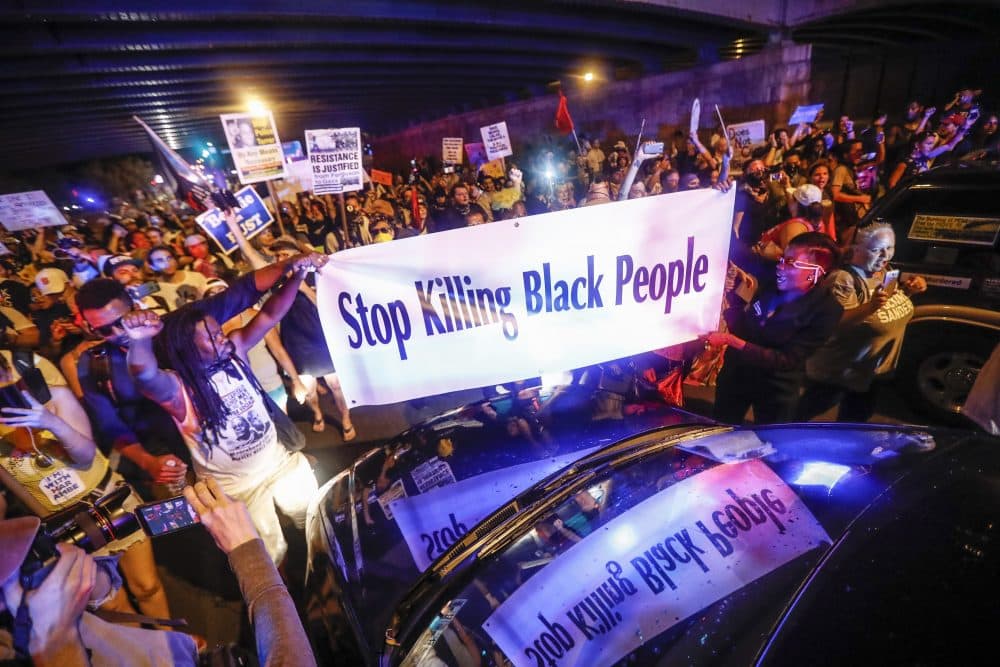 Black Lives Matter demonstrators gather during a protest march south on Broad Street in Philadelphia. (John Minchillo/AP)