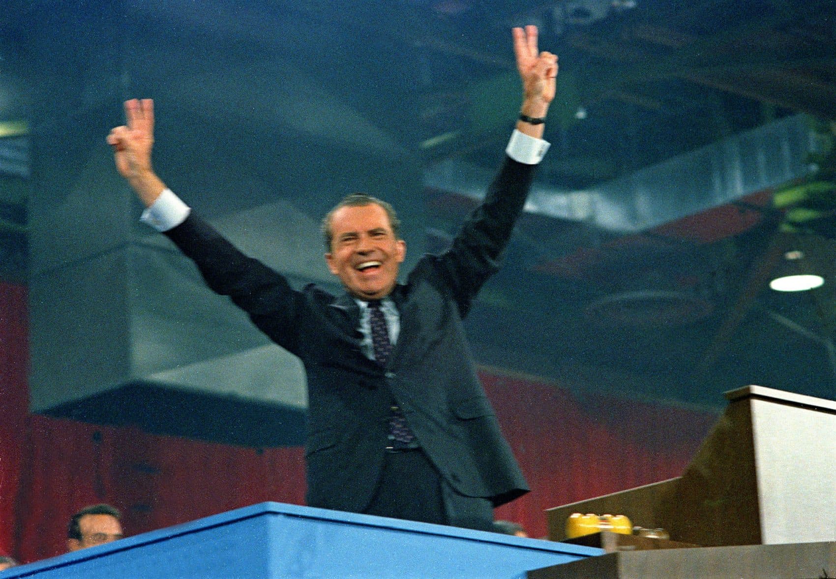 Republican presidential candidate Richard M. Nixon shows the victory sign with both hands after being nominated by his party at the Republican National Convention in Miami, Fla., Aug. 9, 1968. (AP)