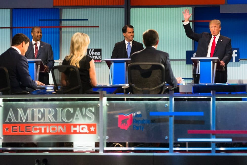 Republican presidential candidate Donald Trump, right, speaks to moderators from left foreground, Bret Baier, Megyn Kelly and Chris Wallace during the first Republican presidential debate at the Quicken Loans Arena Thursday, Aug. 6, 2015, in Cleveland. (John Minchillo/AP) 