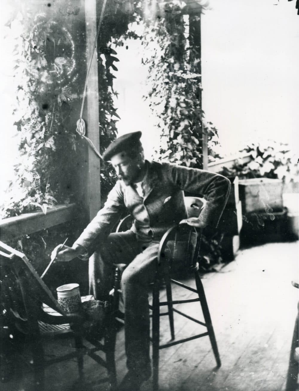 A photograph of the artist painting at Celia Thaxter’s cottage around 1886. (Courtesy PEM)