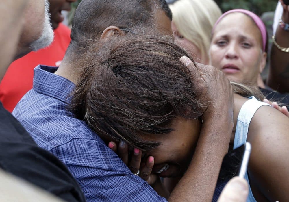 Diamond Reynolds, the girlfriend of Philando Castile, is consoled by a minister outside the governor's residence in St. Paul the day after Castile was shot and killed after a traffic stop by police. (Jim Mone/AP) 