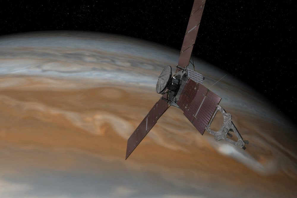 This artist's rendering made available by NASA/JPL-Caltech shows the Juno spacecraft above Jupiter. (NASA and JPL-Caltech/AP)