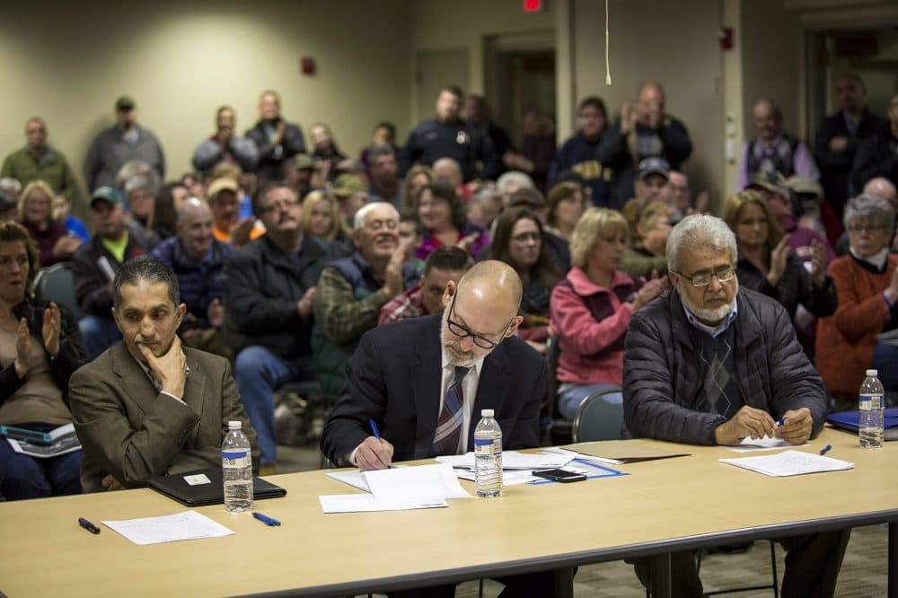 Jay Talerman, center, at a Dudley town meeting in February where the proposal to build a Muslim cemetery was met with opposition by residents. (Jesse Costa/WBUR)