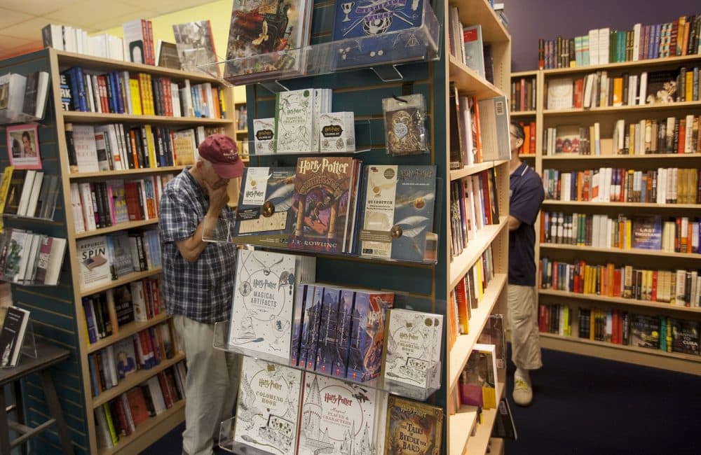 &quot;Harry Potter and the Sorcerer's Stone&quot; (the Scholastic edition) on display at Porter Square Books along with other Potter publications. (Joe Difazio for WBUR)