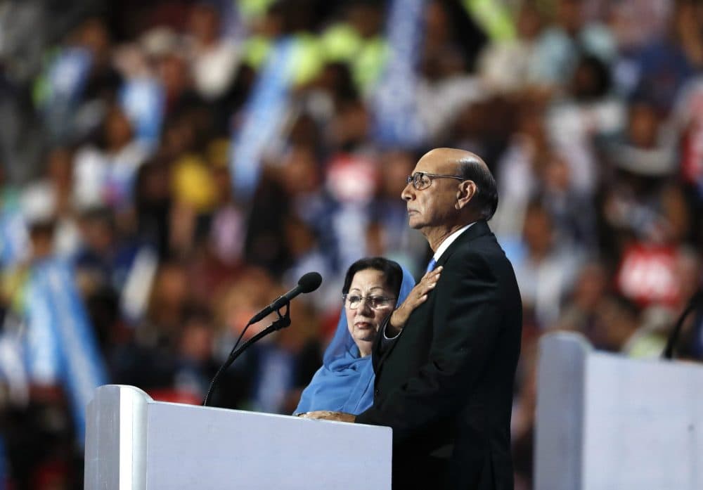 Ghazala and Khizr Khan Khan, parents of fallen U.S. Army Capt. Humayun S. M. Khan, take the stage on the final day of the Democratic National Convention in Philadelphia, July 28, 2016. (Paul Sancya/AP)

