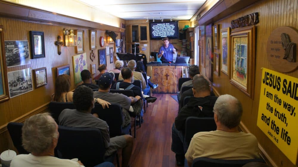 Michael DeBay conducts a Sunday service to drivers inside the truck stop chapel off Interstate 10 in southern California. (Saul Gonzalez/KCRW)