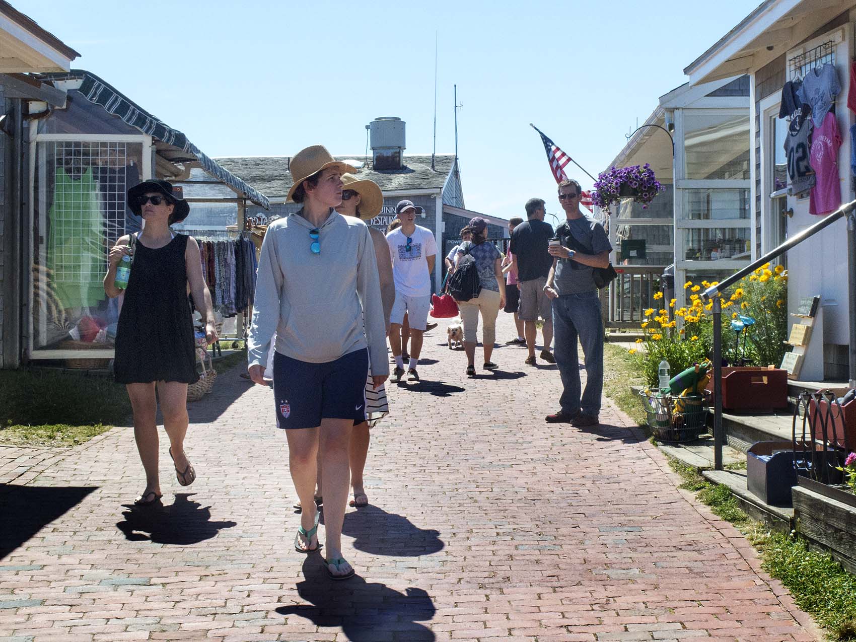 Tourists walk through the Shops at Aquinnah, part of the newly established Aquinnah Cultural District. (Andrea Shea/WBUR)