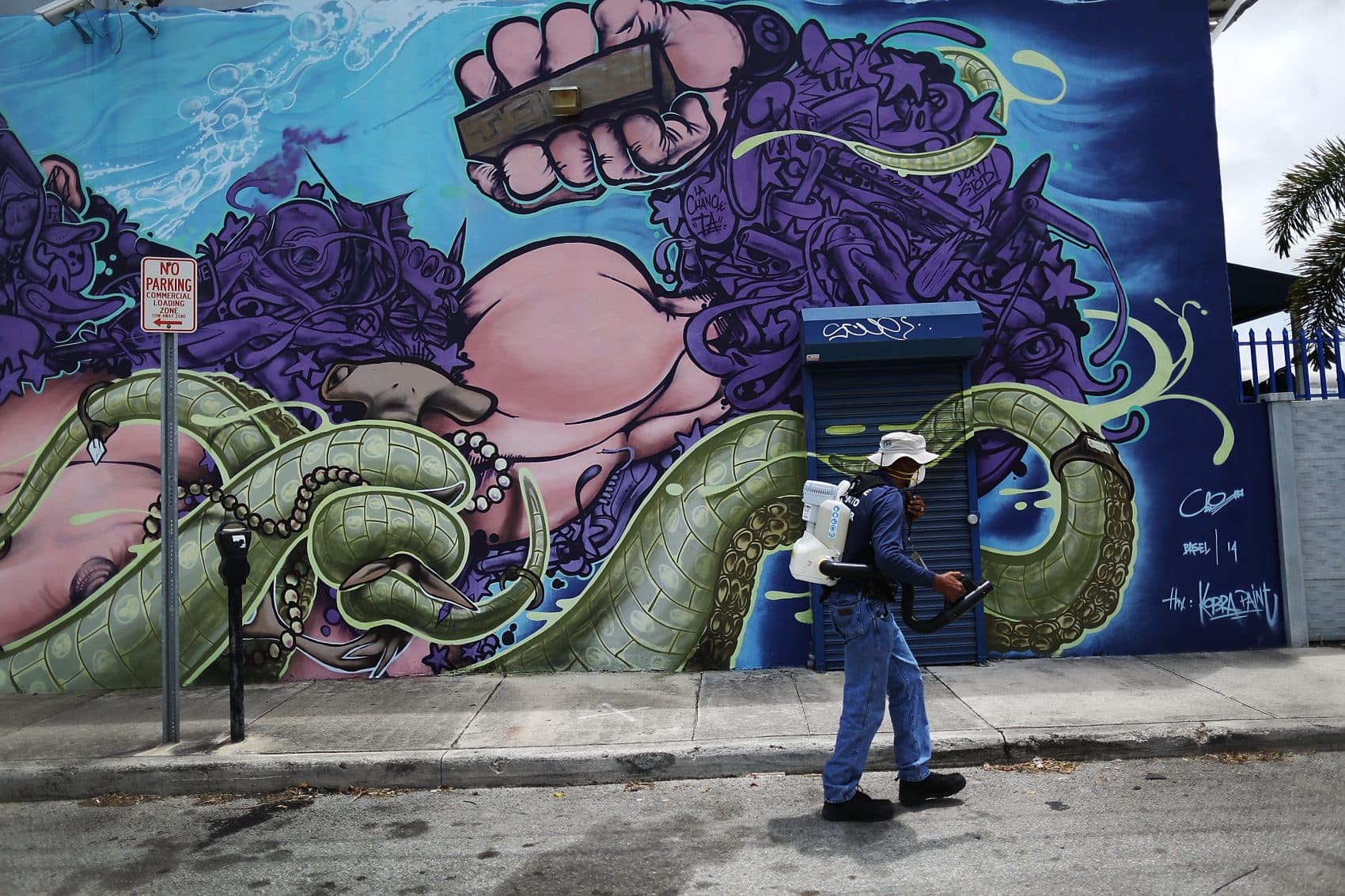 Larry Smart, a Miami-Dade County mosquito control inspector, uses a fogger to spray pesticide to kill mosquitos in the Wynwood neighborhood on Aug.1, 2016 in Miami, Florida. (Joe Raedle/Getty Images)