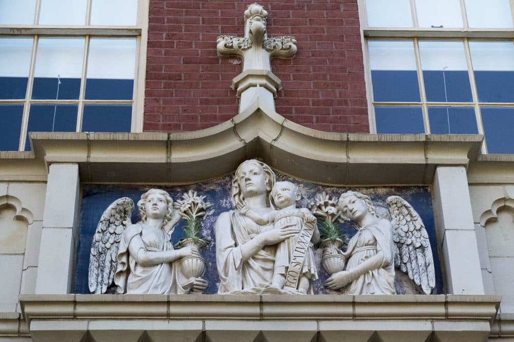 A version of Luca della Robbia’s Madonna and Child decorating the portal of St. Mary of the Assumption School in Brookline. (Andrea Shea/WBUR)