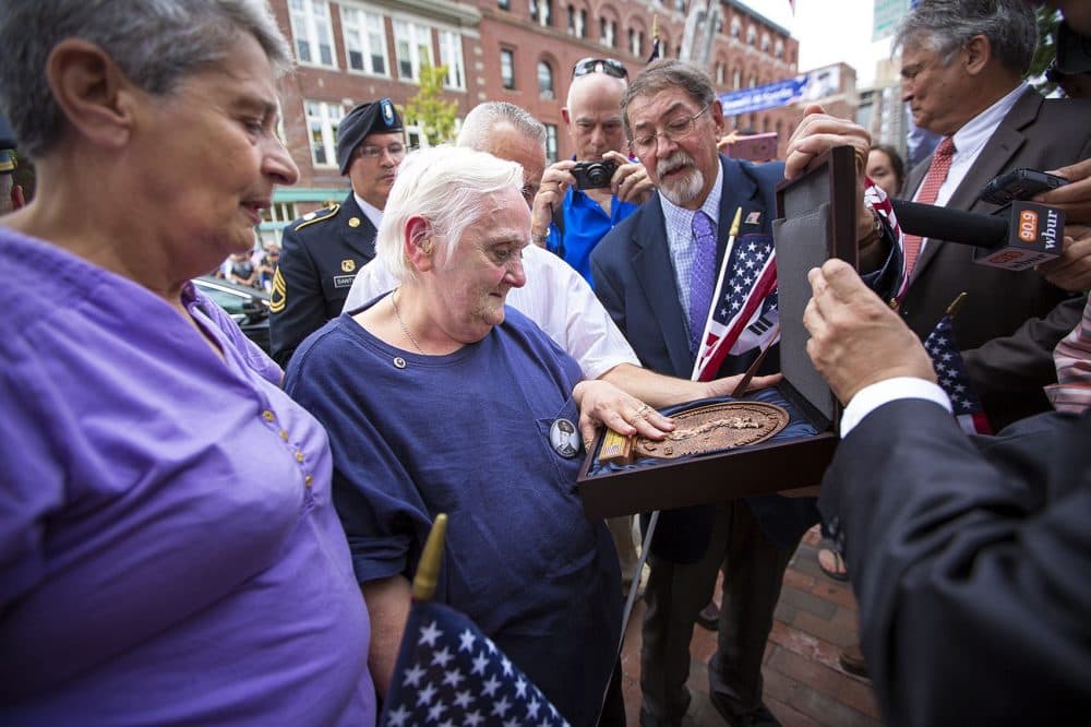 Ronald Sparks' sister, Irene, and her family were presented with a plaque honoring the memory and service of her older brother. (Jesse Costa/WBUR)
