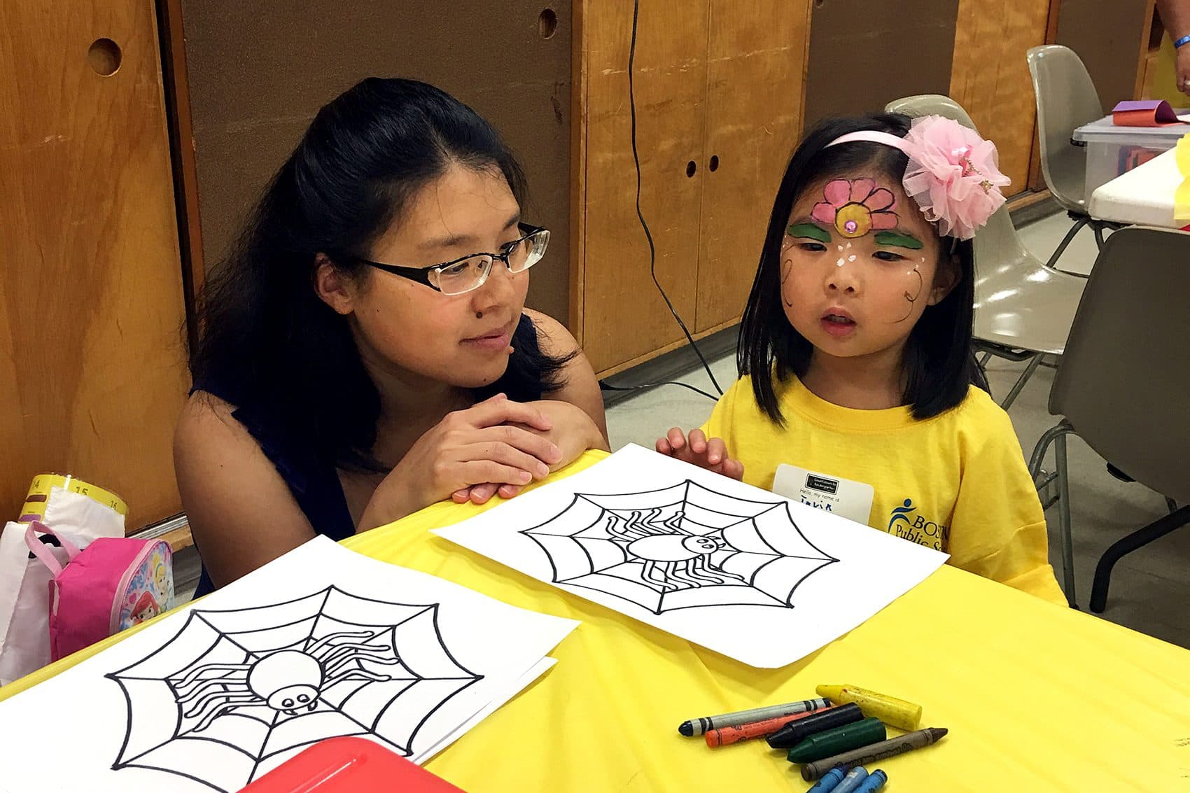 Emily Wu and her 4-year-old daughter, Talia, are at a “Countdown to Kindergarten” party at the South Boston branch of the Boston Public Library. (Tonya Mosley/WBUR)