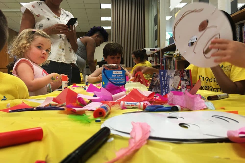 Incoming K1 students do arts and crafts at the “Countdown to Kindergarten” party at the South Boston branch of the Boston Public Library. (Tonya Mosley/WBUR)