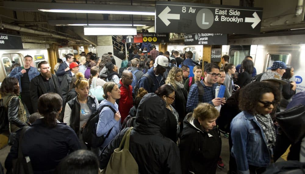 In this May 24, 2016, photo, L train commuters work their way across a crowded subway platform in New York. (Mark Lennihan/AP)