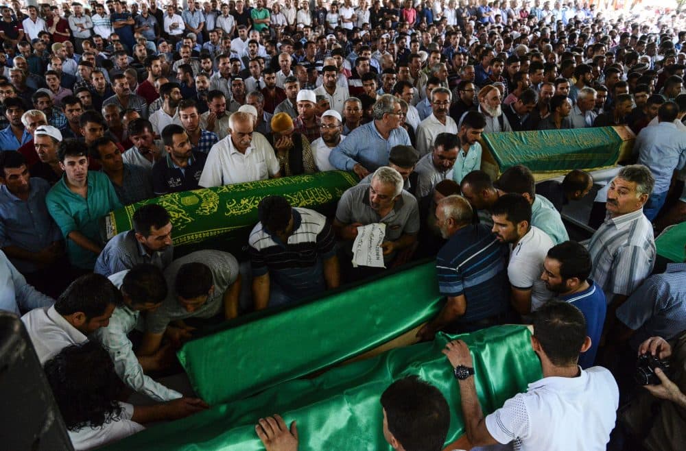 People gather for the funeral of victims of last night's attack on a wedding party that left 50 dead in Gaziantep in southeastern Turkey near the Syrian border on Aug. 21, 2016. (Ilyas Akengin/AFP/Getty Images)