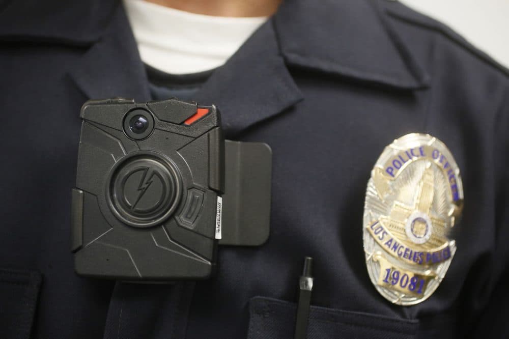 A Los Angeles Police officer wears an on-body camera during a demonstration for media in Los Angeles in 2014. On Wednesday, 100 Boston police officers will begin a six-month body camera pilot program. (Damian Dovarganes/AP)