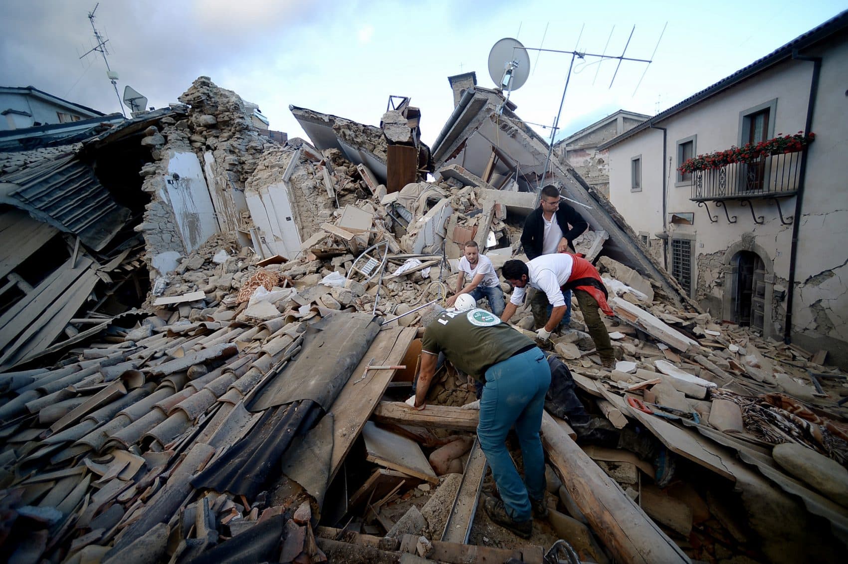 A resident searches for victims in the rubble after a strong earthquake hit Amatrice on Aug. 24, 2016. (Flippo Monteforte/AFP/Getty Images)