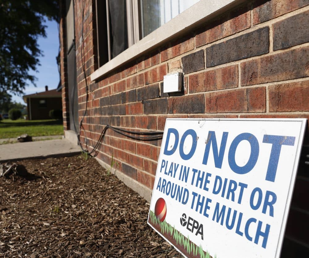 In this Aug. 23, 2016 photo, a sign from the Environmental Protection Agency is posted in front of West Calumet Housing Complex houses at East Chicago, Ind. The EPA has detected high levels of lead in samples of dust and dirt tracked inside homes where soil is tainted with industrial contaminants. (Tae-Gyun Kim/AP)