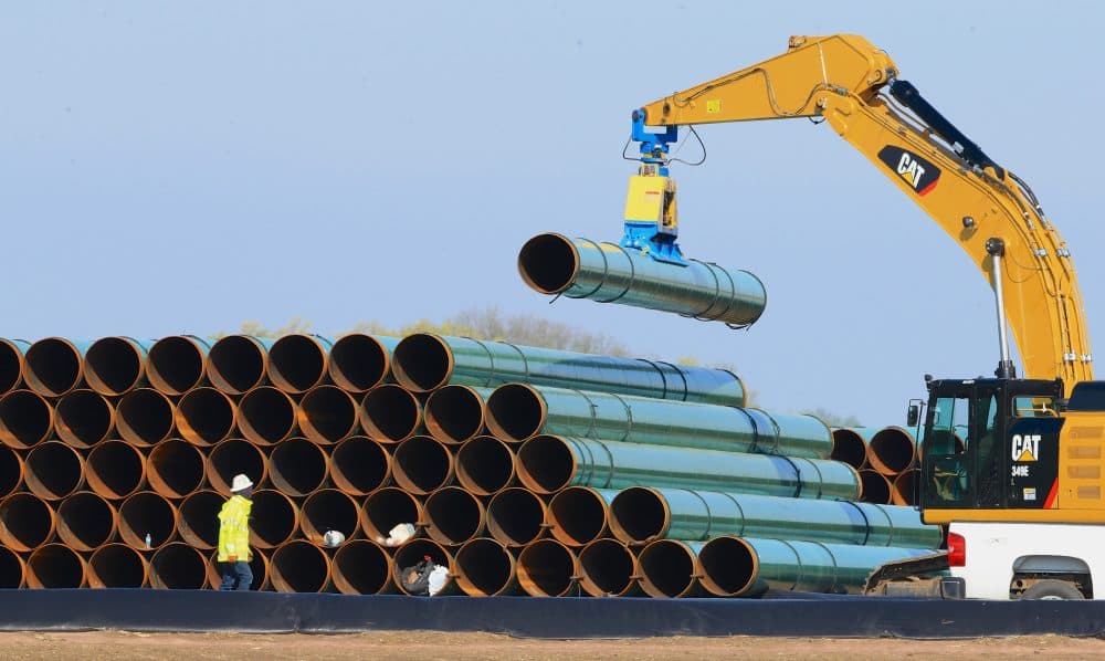 The Supreme Judicial Court on Wednesday did what the state Legislature would not, striking down a Baker administration push to facilitate the construction of new natural gas pipeline capacity in the state by allowing utilities pass the cost of pipeline construction on to ratepayers. In this 2016 file photo, pipes for a proposed pipeline in South Dakota are stacked at a staging area. (Nati Harnik/AP)