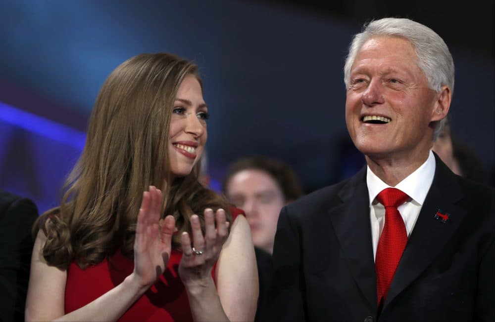 Chelsea Clinton and former President Bill Clinton smile as they listen to Democratic presidential nominee Hillary Clinton speaks during the final day of the Democratic National Convention in Philadelphia, Thursday, July 28, 2016. (Carolyn Kaster/AP)