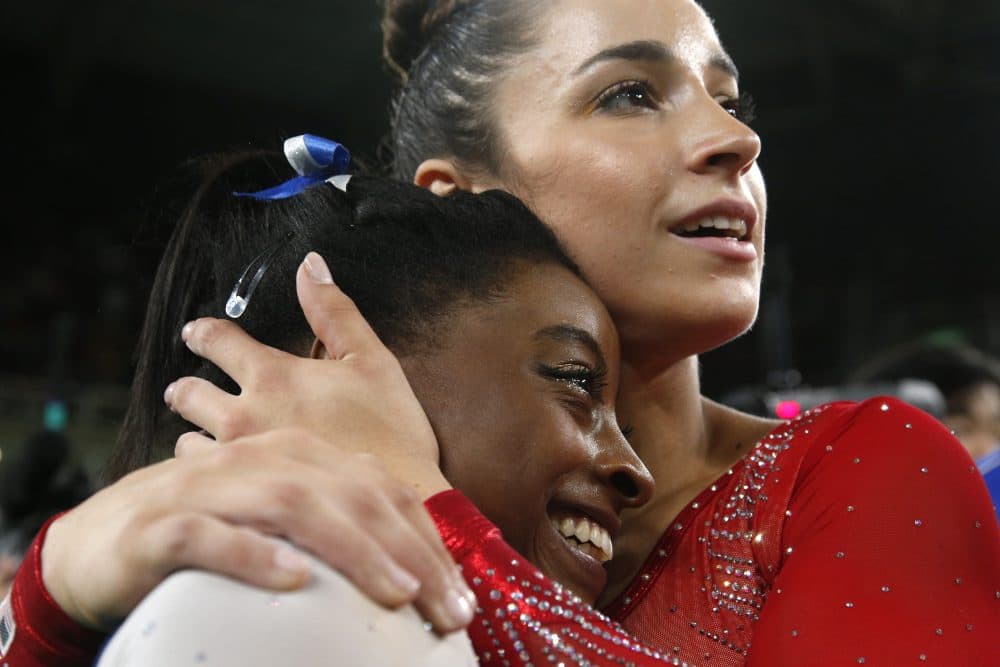 United States' Aly Raisman embraces compatriot Simone Biles after they won silver and gold respectively for the gymnastics women's individual all-around final at the 2016 Summer Olympics in Rio de Janeiro, Brazil, Thursday, Aug. 11, 2016. (Dmitri Lovetsky/AP)