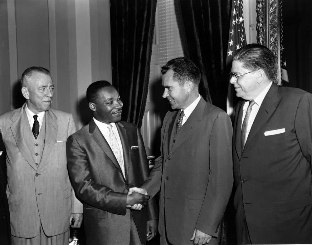 Dr. Martin Luther King Jr., second from left, shakes hands with then-Vice President Richard Nixon as they meet to discuss race issues in the South, June 13, 1957. Sen. Irving M. Ives (R-N.Y.) and Secretary of Labor James P. Mitchell, far left and far right, look on. (Henry Griffin/AP)