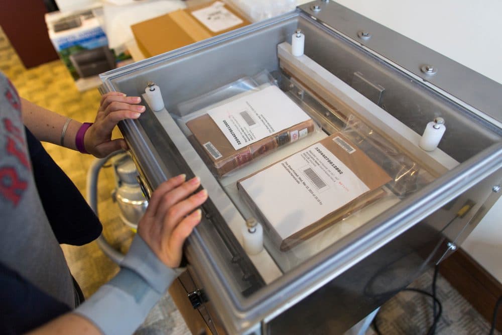 After the case law books are scanned, they are sealed with their original bindings before being shipped to Kentucky for storage. (Brooks Kraft/Harvard Law School)