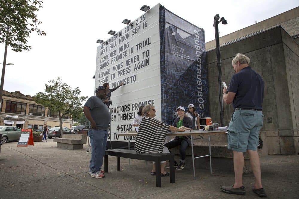 A giant billboard displays promises made in public, at &quot;Public Trust&quot; in Dudley Square, Boston. (Robin Lubbock/WBUR)