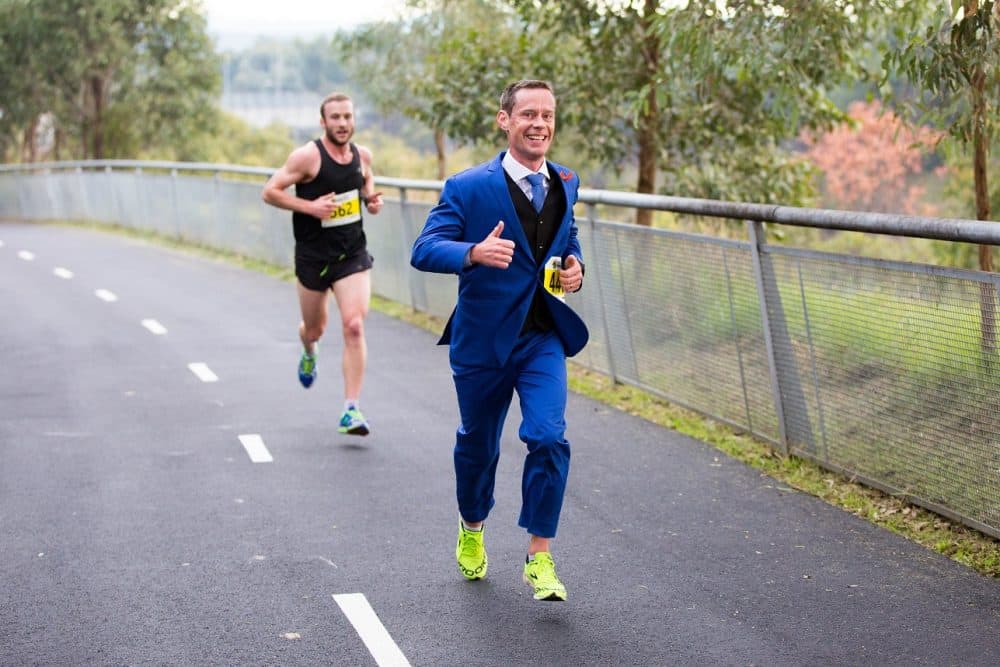 For Mike Tozer, running (in a suit) has become a way to cope with a difficult diagnosis. (Courtesy of Mike Tozer)