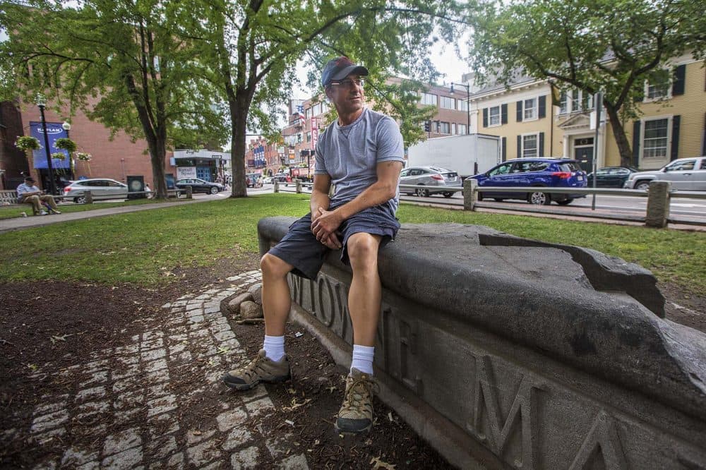 Greg Diatchenko, now 52, sits in Winthrop Square Park in Harvard Square. When he was 17, Diatchenko was sent to prison for life for fatally stabbing a 55-year-old. (Jesse Costa/WBUR)
