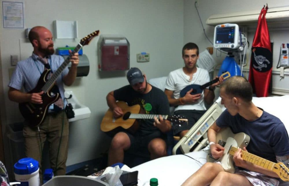 Brian Schreck, left, plays music with Nate Kramer, right, and Nate's brothers. (Courtesy of Vince Kramer)