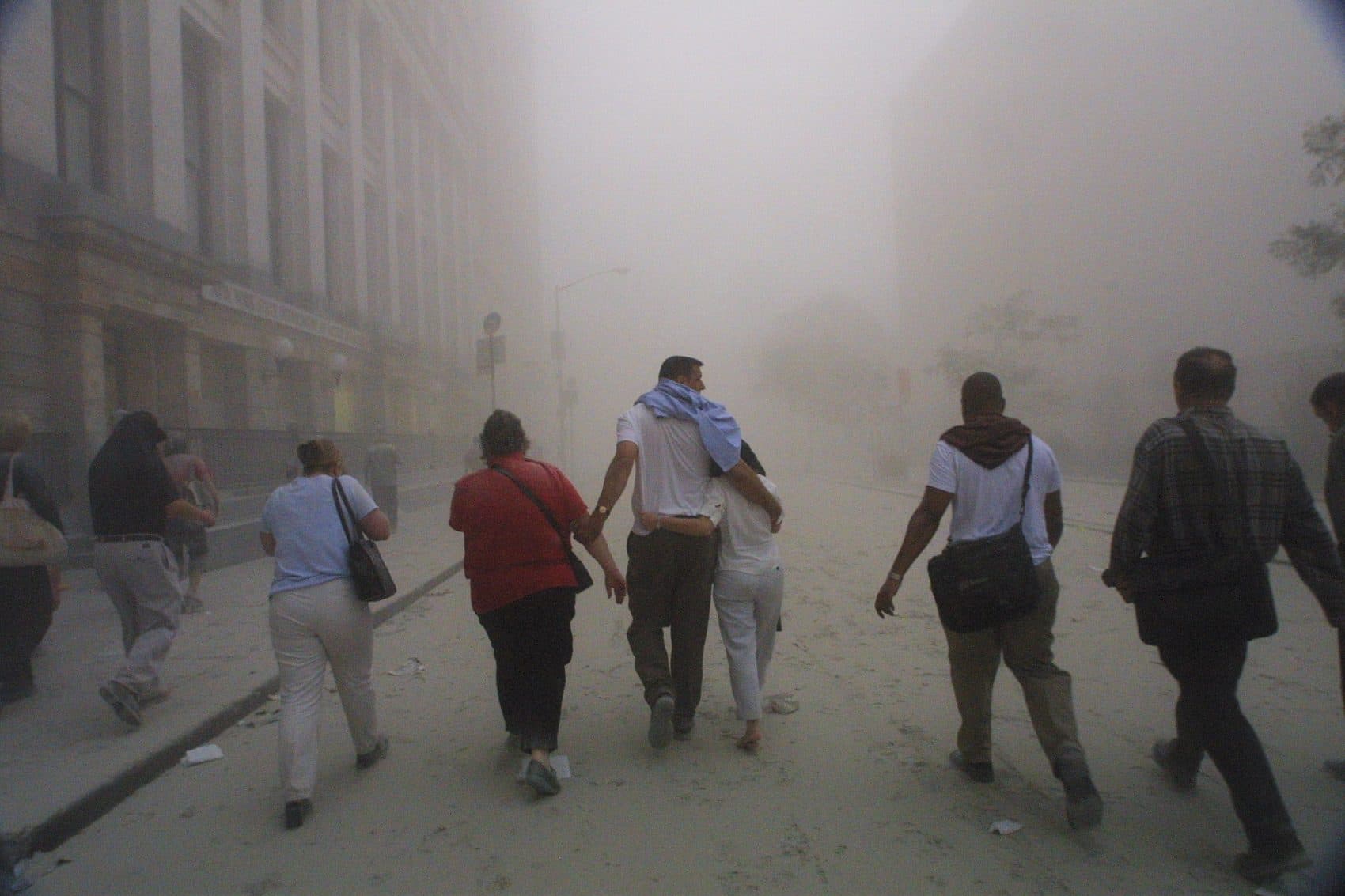 Civilians flee as a tower of the World Trade Center collapses Sept. 11, 2001. (Mario Tama/Getty Images)