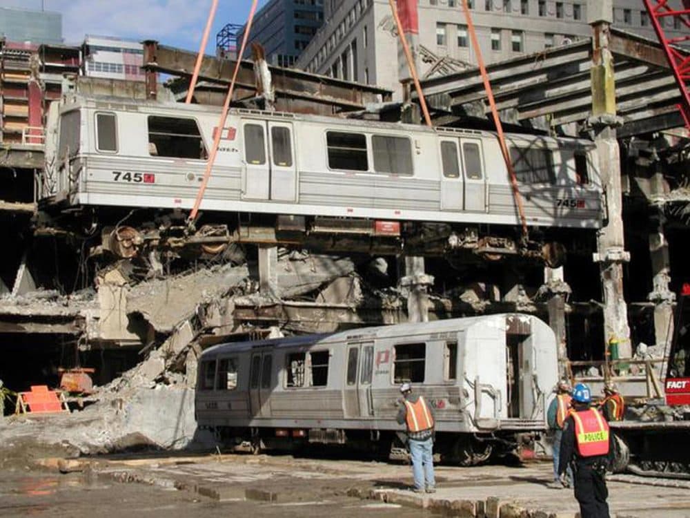 During recovery from the World Trade Center wreckage, Car 745 is swung over Car 143 by crane. (Peter Rinaldi/Shoreline Trolley Museum)