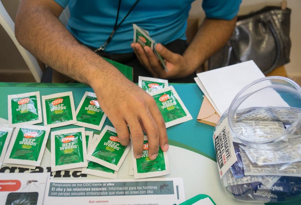 Condoms, bug repellent wipes and literature on the prevention of ZIka and other diseases handed out by health clinic workers during a wellness fair in the Las Cuevas neighborhood on Aug. 31, 2016 in Loiza, Puerto Rico. (Angel Valentin/Getty Images)