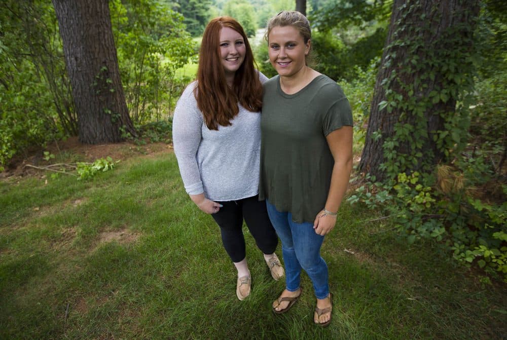 Anna Sweeney, left, and Carly Gorden in the Sweeney family backyard in Boxborough. (Jesse Costa/WBUR)