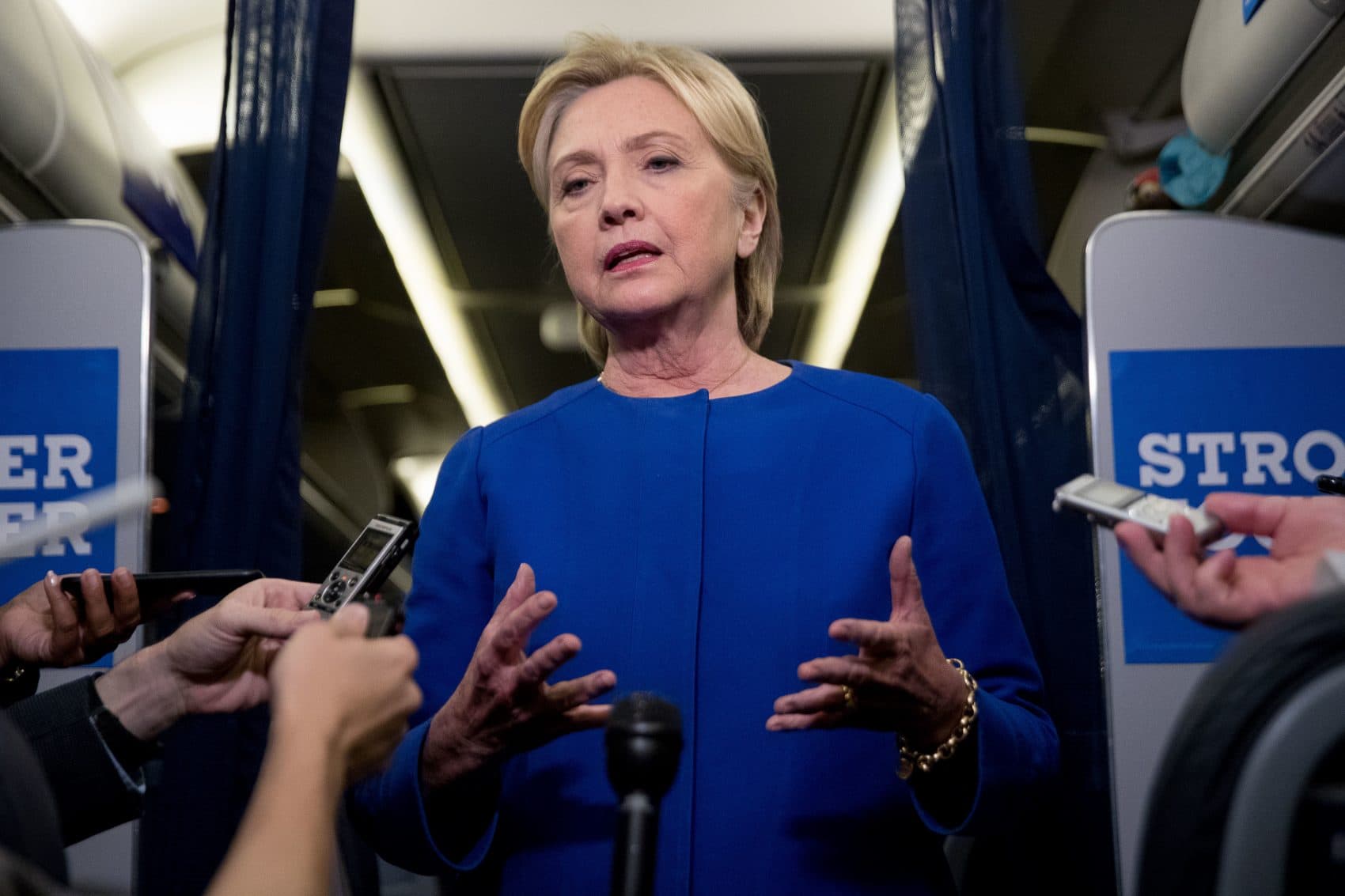 Democratic presidential candidate Hillary Clinton gives remarks on the explosion in Manhattan's Chelsea neighborhood onboard her campaign plane at Westchester County Airport, in White Plains, N.Y., Saturday, Sept. 17, 2016. (Andrew Harnik/AP)
