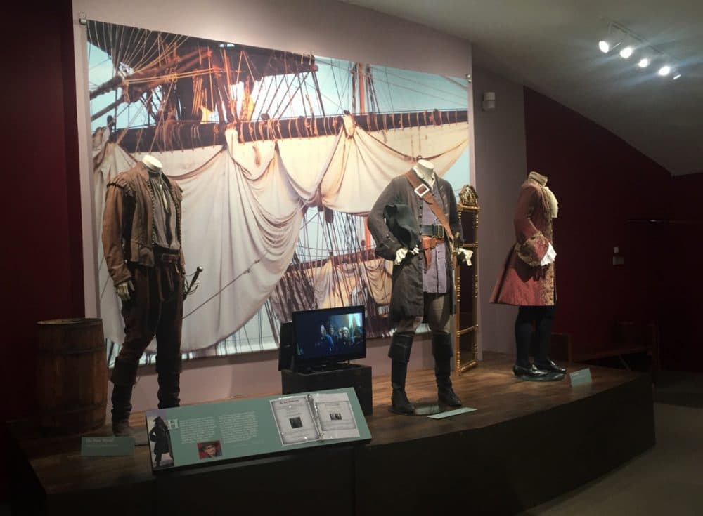 Jack Sparrow’s “Pirates of the Caribbean: The Curse of the Black Pearl” costume (by Penny Rose) is flanked on the left by Colin Farrell as Captain John Smith in “The New World” (by Jacqueline West) and on the right by Heath Ledger as Giacomo Casanova in “Casanova” (by Jenny Beavan). (Erin Trahan for WBUR)