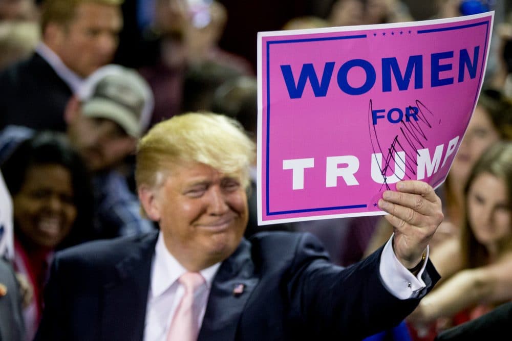 Republican presidential candidate Donald Trump holds up a sign that reads &quot;Women for Trump&quot; after speaking at a rally at Valdosta State University in Valdosta, Ga., Feb. 29, 2016. (Andrew Harnik/AP)