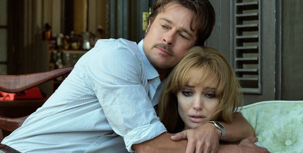 This photo provided by Universal Pictures shows, Brad Pitt, left, as Roland comforting Angelina Jolie Pitt as Vanessa in a scene from the 2015 film &quot;By the Sea,&quot; directed by Jolie Pitt. (AP)