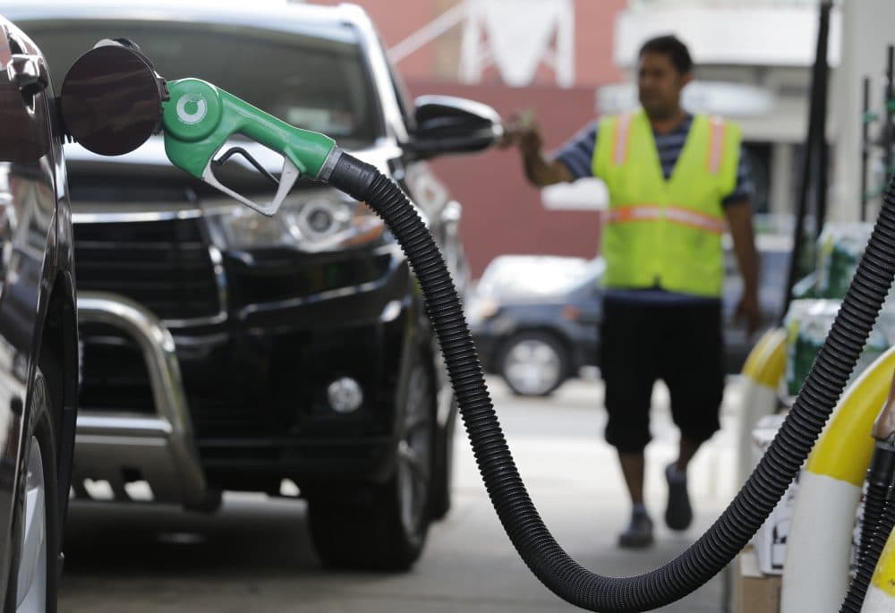 A nozzle pumps gas into a vehicle at a BP gas station, Thursday, June 30, 2016, in Hoboken, N.J. Switching to a car with better fuel economy is one way individuals can combat climate change, according to author and climate scientist Brenda Ekwurzel. (Julio Cortez/AP)