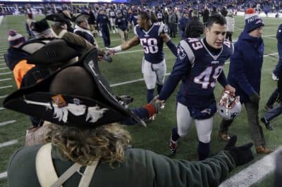 Cardona's tight schedule has him traveling between Foxboro for games, and Newport to work at the Navy Prep School. (AP Photo/Charles Krupa)