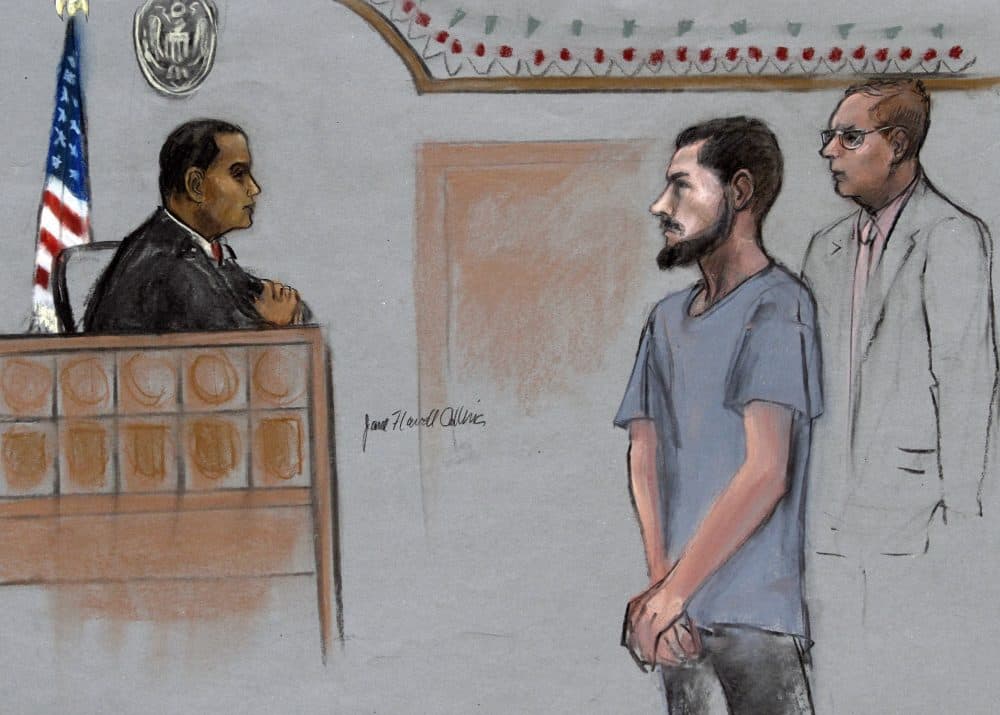 In this June 12, 2015, file courtroom sketch, Nicholas Rovinski, of Warwick, Rhode Island, is depicted standing with his attorney during a hearing in federal court in Boston. (Jane Flavell Collins via AP)