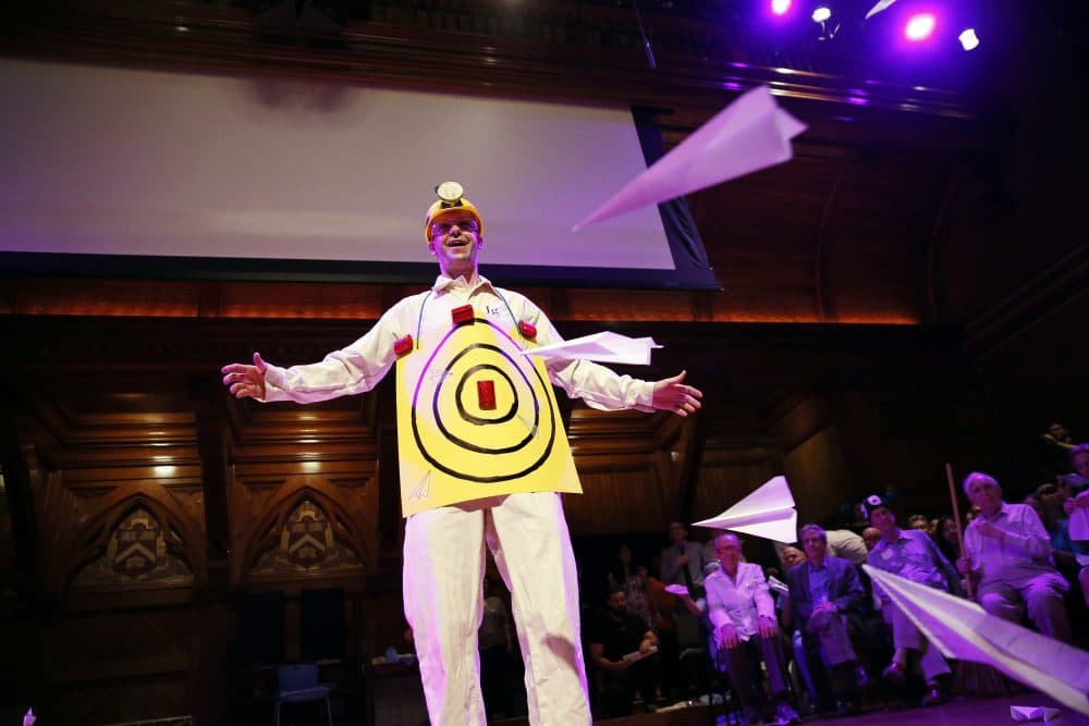 Human Aeorodrome Eric Workman acts as a target for paper airplanes during the Ig Nobel award ceremonies at Harvard University in Cambridge, Mass. on Thursday. (Michael Dwyer/AP)