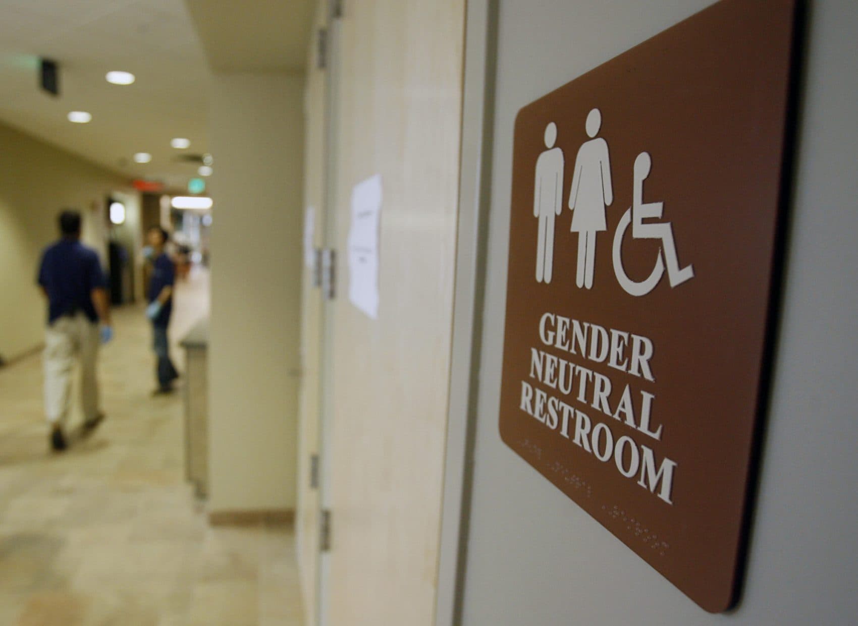 In this Aug. 23, 2007, file photo, a sign marks the entrance to a gender-neutral restroom at the University of Vermont in Burlington. (Toby Talbot/AP)