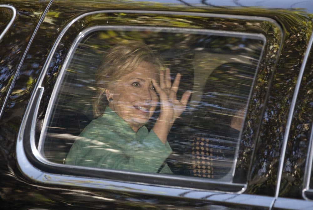 Democratic presidential candidate Hillary Clinton waves from her motorcade vehicle as she arrives for a fundraiser at the home of Justin Timberlake and Jessica Biel in Los Angeles, Tuesday, Aug. 23, 2016. (Carolyn Kaster/AP)