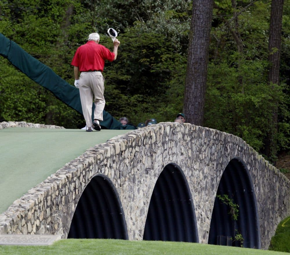File- This April 9, 2004, file photo shows Arnold Palmer walking across the Hogan Bridge on the 12th fairway for the final time in Masters competition during the second round of the Masters golf tournament at the Augusta National Golf Club in Augusta, Ga. (Amy Sancetta/AP)