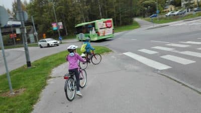 The author's children riding their bicycles to school. (Author/Courtesy)