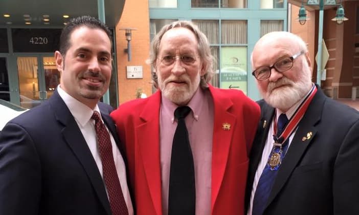 Ralph Morales, left, and Michael Reagan, right, with John Nunn, a Navy Corpsman who tried to save Vincent Santaniello's life in 1968 (Courtesy of Michael Reagan)