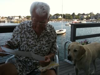 William Barney works on the family genealogy on the deck of his home on Nantucket, "The Barnacle." (Courtesy Libby Holman)