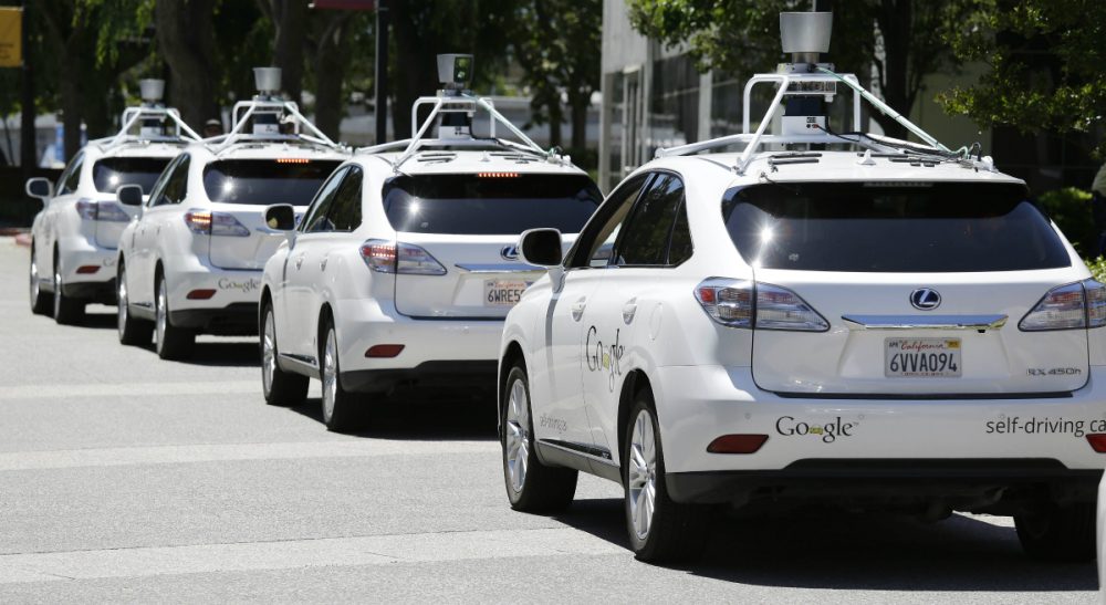Massachusetts is moving toward providing a regulatory framework for testing autonomous vehicles in the state. Pictured: A row of Google self-driving Lexus cars at the Computer History Museum in Mountain View, California. (Eric Risberg/AP)