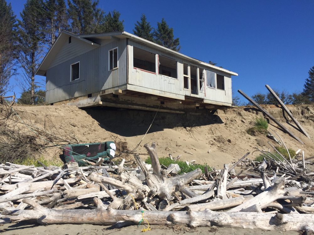 This will probably be the next in a long series of homes to fall into the sea at Washaway Beach, Washington. (Tom Banse/Northwest News Network)